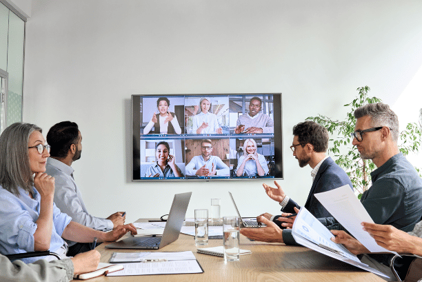 Employees having a virtual video conference through Zoom