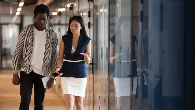 Project managers walking in office.