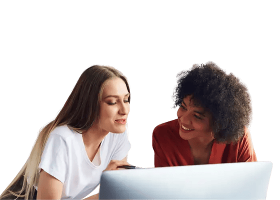 Two people at a laptop streamlining rewards with Zapier.