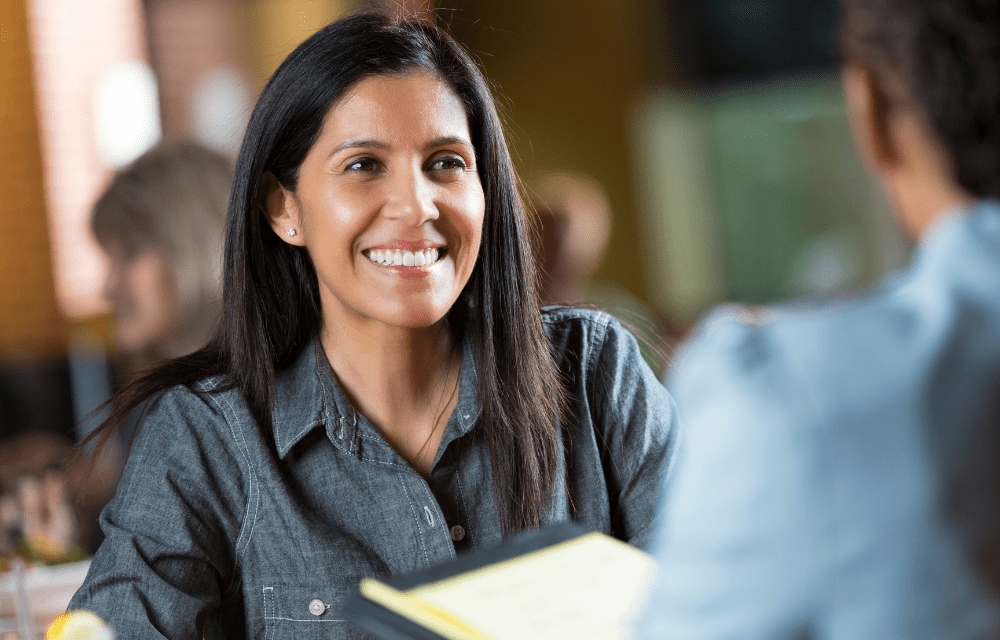 Woman in job interview attracted by good corporate culture.