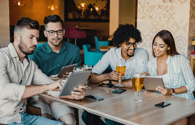 Team of employees happy after gift card rewards.