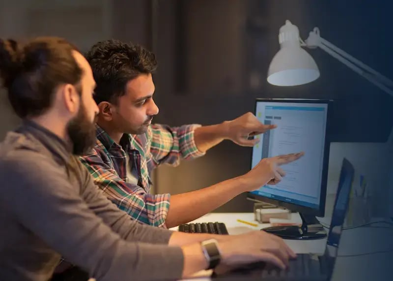 Two developers choosing the right gift card API software.