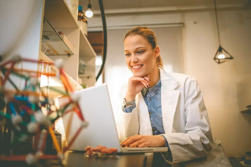 academic researcher working on laptop