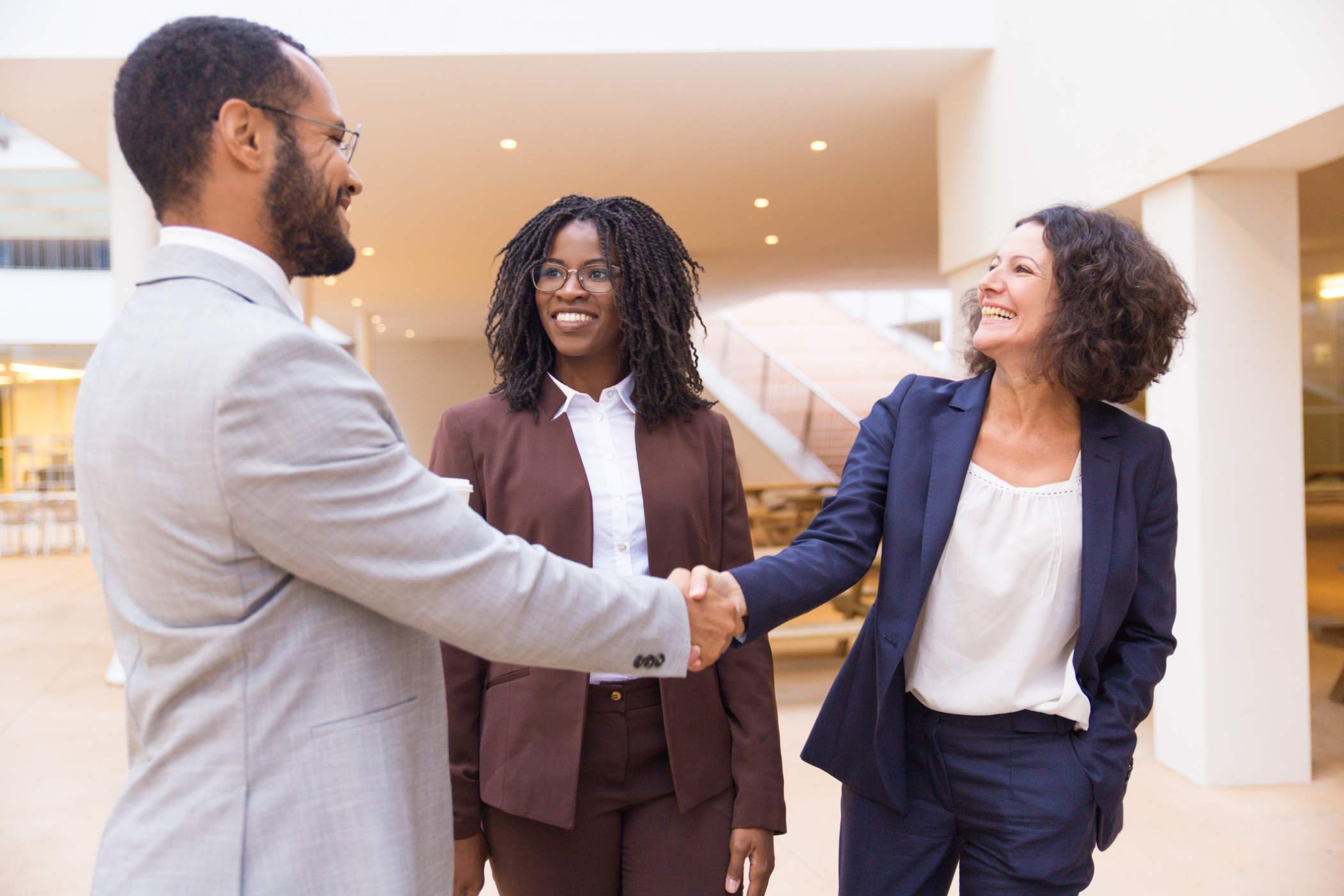 business owner shaking hands with potential lead