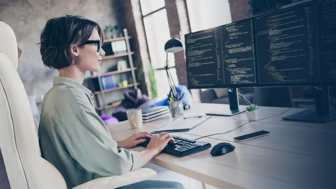 female developer at computer working on a gift card API