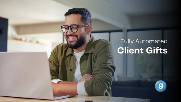 fully automated client gifts graphic with man looking at laptop