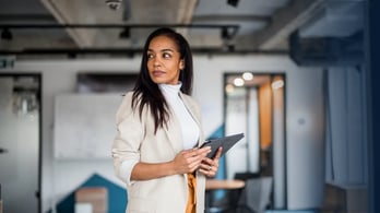 gift cards versus prepaid cards featured image business woman in the office holding a table