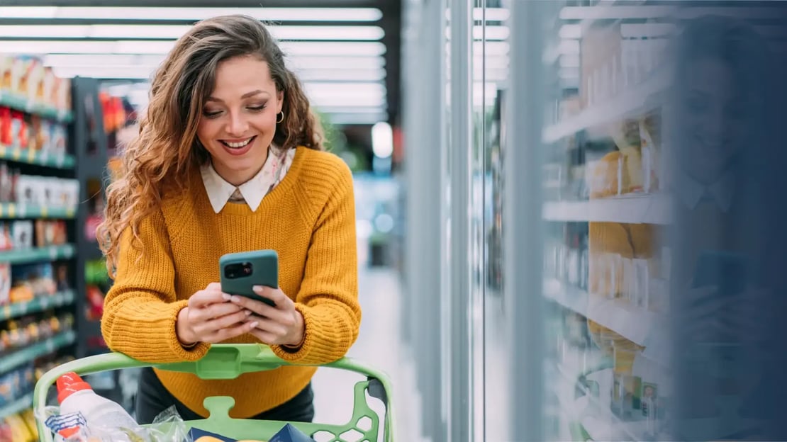 grocery gift cards for employees featured image woman shopping in grocery store