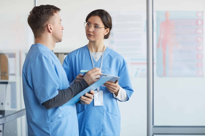 OPT Blog Image - Nurses talking to each other during their shift at the hospital