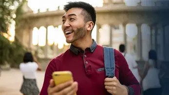 how to send global rewards featured image student abroad happy to get reward on his phone